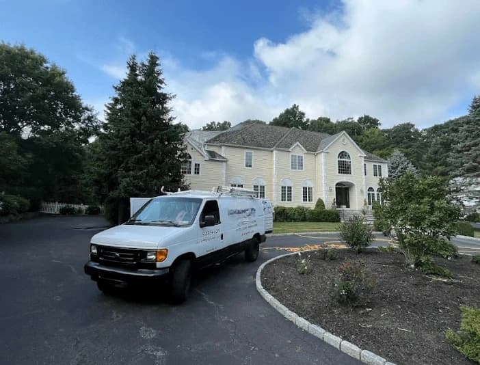 Middleburg Heights Power Washing technician performing thorough gutter cleaning service in Middleburg Heights