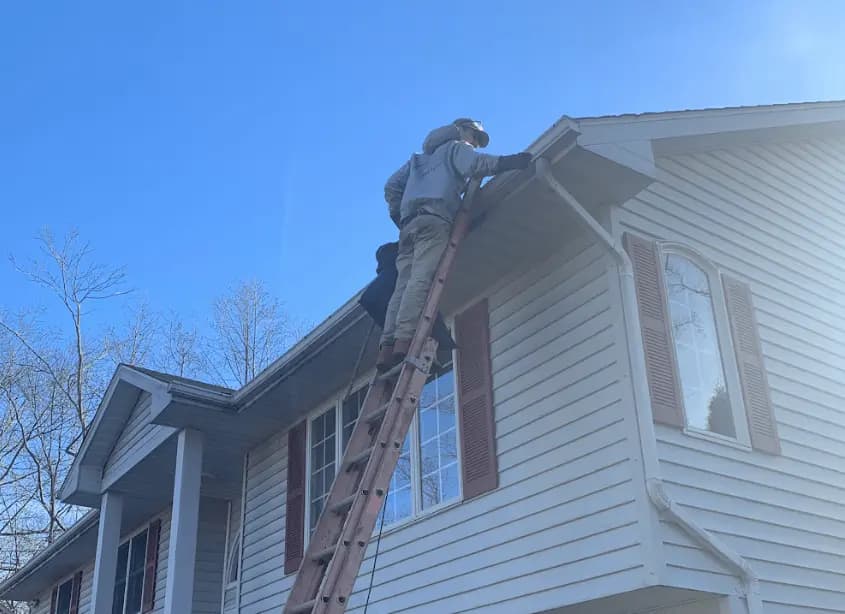 Gutter cleaning and maintenance being performed by Middleburg Heights Power Washing in Middleburg Heights